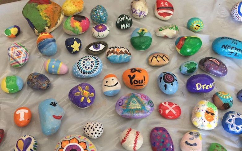<p>A collection of painted rocks that will soon add color and hope to a United States Army Hospital in Kuwait.</p>
