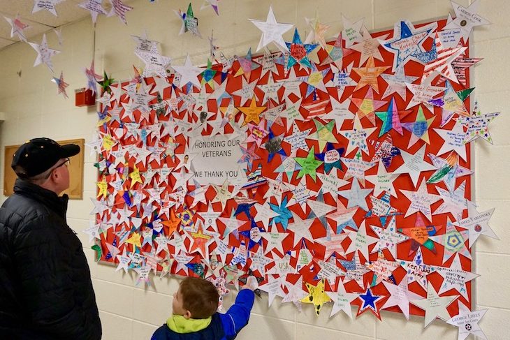 <p>AGS students and staff members honored veterans who have touched their hearts with a wall of stars. </p>
